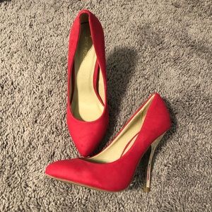 Never Worn red pumps with gold heels